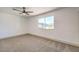 Well-lit bedroom featuring a ceiling fan and window at 7205 Carrondale Way, Las Vegas, NV 89128