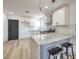 Modern kitchen with granite countertops and white cabinets at 7205 Carrondale Way, Las Vegas, NV 89128