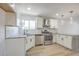 Updated kitchen featuring granite countertops and stainless steel appliances at 7205 Carrondale Way, Las Vegas, NV 89128