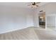 Primary bedroom with mirrored closet and ceiling fan at 7445 Shangri La Ave, Las Vegas, NV 89147