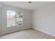 Bright bedroom with light flooring and sliding glass door at 7445 Shangri La Ave, Las Vegas, NV 89147