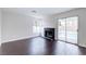 Bright living room with fireplace and sliding glass doors to a pool at 7445 Shangri La Ave, Las Vegas, NV 89147