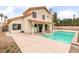 Home with a refreshing pool and covered patio at 7445 Shangri La Ave, Las Vegas, NV 89147