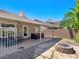 Relaxing backyard patio with seating area and fire pit at 8474 Orange Cliff Ct, Las Vegas, NV 89123