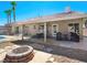 Covered patio, fire pit, and sparkling pool in backyard at 8474 Orange Cliff Ct, Las Vegas, NV 89123