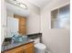 Bathroom features glass bowl sink, granite countertop, modern lighting, and a window at 8474 Orange Cliff Ct, Las Vegas, NV 89123