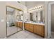 Large bathroom with double vanity and mirrored closet at 8474 Orange Cliff Ct, Las Vegas, NV 89123