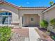 Front entryway with covered porch and landscaping at 8474 Orange Cliff Ct, Las Vegas, NV 89123