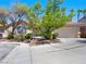 House exterior with driveway and mature trees at 8474 Orange Cliff Ct, Las Vegas, NV 89123