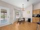 Cozy kitchen nook with wood floors and backyard access at 8474 Orange Cliff Ct, Las Vegas, NV 89123