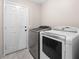 Laundry room with washer, dryer, and exterior access at 8474 Orange Cliff Ct, Las Vegas, NV 89123