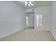 Large bedroom with ceiling fan, carpet, and access to bathroom at 8805 Jeffreys St # 1019, Las Vegas, NV 89123