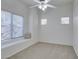 Bedroom with window seat, ceiling fan, and carpet at 8805 Jeffreys St # 1019, Las Vegas, NV 89123