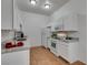 White kitchen with granite countertops and stainless steel sink at 8805 Jeffreys St # 1019, Las Vegas, NV 89123