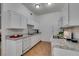 White kitchen with granite counters and appliances at 8805 Jeffreys St # 1019, Las Vegas, NV 89123