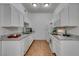 Modern kitchen featuring white cabinetry and granite countertops at 8805 Jeffreys St # 1019, Las Vegas, NV 89123