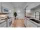 View of kitchen with granite counters and white cabinets at 8805 Jeffreys St # 1019, Las Vegas, NV 89123