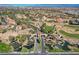 Aerial view of a residential community featuring lush landscaping, golf course, and water features at 8941 Diamond Falls Dr, Las Vegas, NV 89117