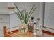 Bar cart featuring bottles, plants, wood and gold accents at 8941 Diamond Falls Dr, Las Vegas, NV 89117