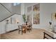 Modern dining room with large windows and wood floors at 8941 Diamond Falls Dr, Las Vegas, NV 89117