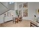 Bright dining room featuring hardwood floors, modern furniture, and an abundance of natural light at 8941 Diamond Falls Dr, Las Vegas, NV 89117