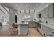 Modern kitchen with gray cabinets, quartz countertops and an island at 8941 Diamond Falls Dr, Las Vegas, NV 89117