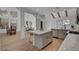 Open kitchen island with white quartz countertop and gray shaker cabinets at 8941 Diamond Falls Dr, Las Vegas, NV 89117