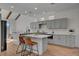 Modern kitchen with gray cabinets, quartz countertops, and stainless steel appliances at 8941 Diamond Falls Dr, Las Vegas, NV 89117