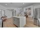 Kitchen island with white countertop and gray cabinets, open to dining area at 8941 Diamond Falls Dr, Las Vegas, NV 89117