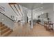 Bright open-concept living room and kitchen with vaulted ceilings and wood beam accents at 8941 Diamond Falls Dr, Las Vegas, NV 89117