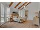 Relaxing main bedroom with exposed beams, modern decor, and an ensuite bathroom at 8941 Diamond Falls Dr, Las Vegas, NV 89117