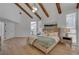 Relaxing main bedroom with exposed beams, modern decor, and natural lighting at 8941 Diamond Falls Dr, Las Vegas, NV 89117