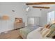 Relaxing main bedroom with exposed beams, modern decor, and a neutral color palette at 8941 Diamond Falls Dr, Las Vegas, NV 89117