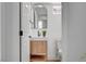 This stylish powder room features a modern vanity, decorative mirror, and sleek fixtures for a contemporary look at 8941 Diamond Falls Dr, Las Vegas, NV 89117