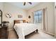 Bedroom featuring a ceiling fan, natural light, and a dresser with decoration at 904 Domnus Ln # 201, Las Vegas, NV 89144