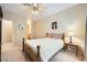 Comfortable bedroom featuring a ceiling fan, natural light, and side tables with lamps at 904 Domnus Ln # 201, Las Vegas, NV 89144