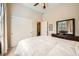 Bedroom featuring a ceiling fan, natural light, a dresser with a mirror and a closet at 904 Domnus Ln # 201, Las Vegas, NV 89144