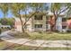 Community buildings showcase neutral tones and tree-lined walkways at 904 Domnus Ln # 201, Las Vegas, NV 89144