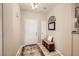 Welcoming foyer with a beautiful rug, bench seat, storage and decorative mirror at 904 Domnus Ln # 201, Las Vegas, NV 89144