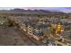 Luxury condo building with mountain and city views at sunset at 9201 Las Manaitas Ave # 302, Las Vegas, NV 89144