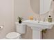 Modern pedestal sink and toilet in a stylish, updated bathroom at 9201 Las Manaitas Ave # 302, Las Vegas, NV 89144