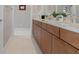 Modern bathroom with double vanity and wood cabinets at 9201 Las Manaitas Ave # 302, Las Vegas, NV 89144