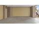 Attached garage with beige door and ample parking space at 9201 Las Manaitas Ave # 302, Las Vegas, NV 89144