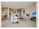 Open living room with modern furniture and access to kitchen at 9201 Las Manaitas Ave # 302, Las Vegas, NV 89144