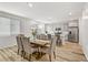 Kitchen and dining area with hardwood floors, large island, and six chairs at 9281 Albus Hills Ave, Las Vegas, NV 89143