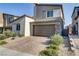 Two-story home with brown garage door and landscaped front at 9281 Albus Hills Ave, Las Vegas, NV 89143