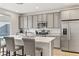 Modern kitchen with gray cabinets, white quartz countertops, and stainless steel appliances at 9281 Albus Hills Ave, Las Vegas, NV 89143