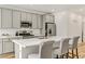 Modern kitchen with gray cabinets, white quartz countertops and island at 9281 Albus Hills Ave, Las Vegas, NV 89143