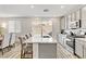 Modern kitchen with gray cabinets, white quartz countertops, and stainless steel appliances at 9281 Albus Hills Ave, Las Vegas, NV 89143