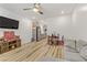 Open concept living space with a gray couch and views into the kitchen area at 9281 Albus Hills Ave, Las Vegas, NV 89143